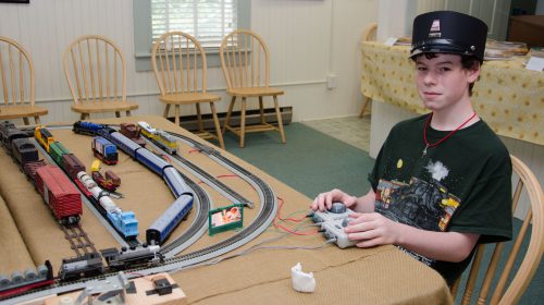 Kid playing with trains
